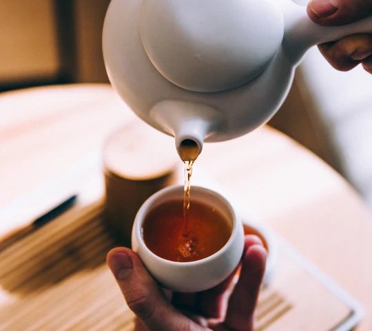 imgi 109 hand pouring hot tea 540x 1